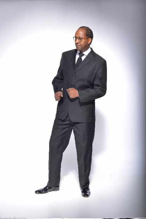 Toni Lorenzo full body portrait in a suit