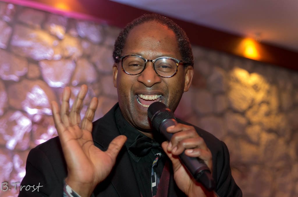 Toni Lorenzo singing live with a microphone