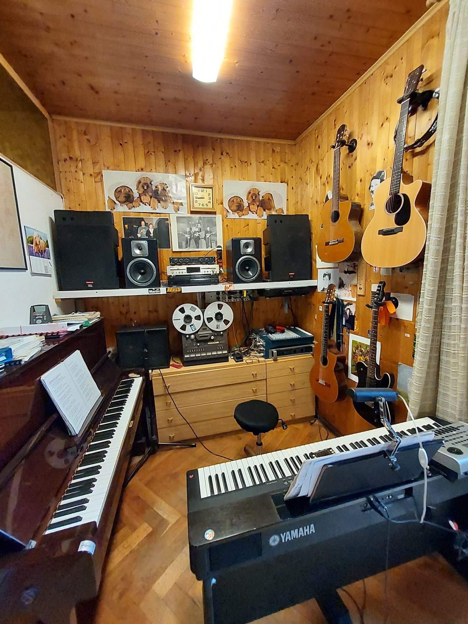Toni studio room with piano, keyboards and guitars